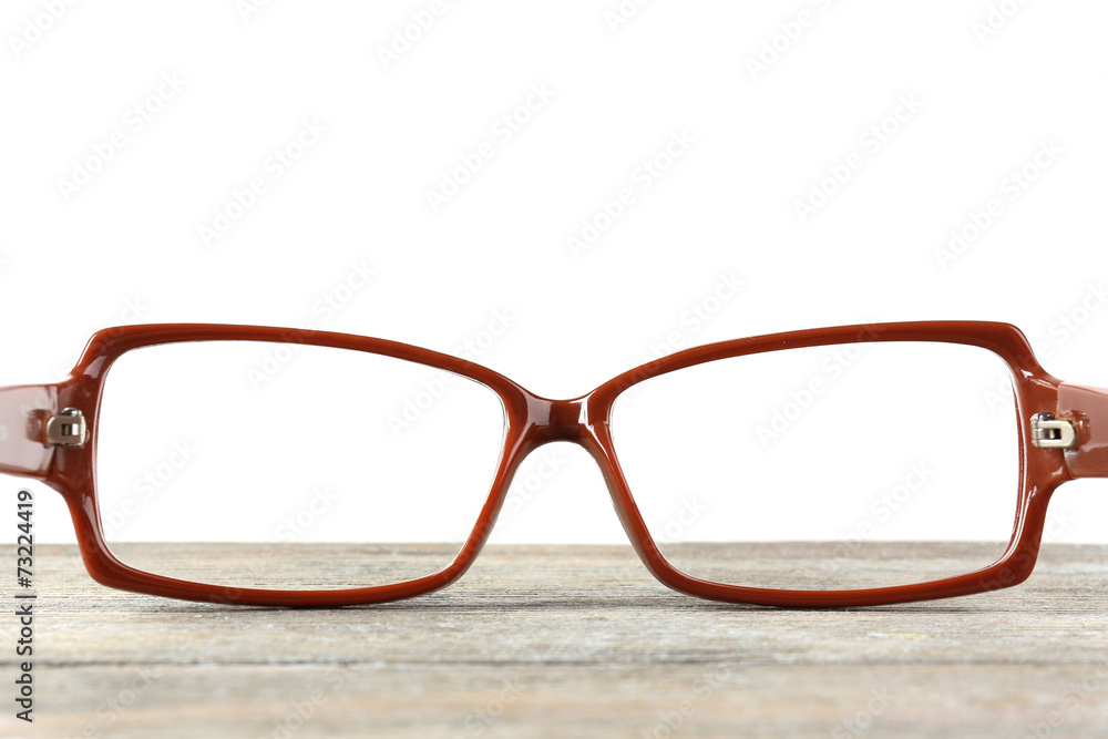 Eye glasses on table on white background