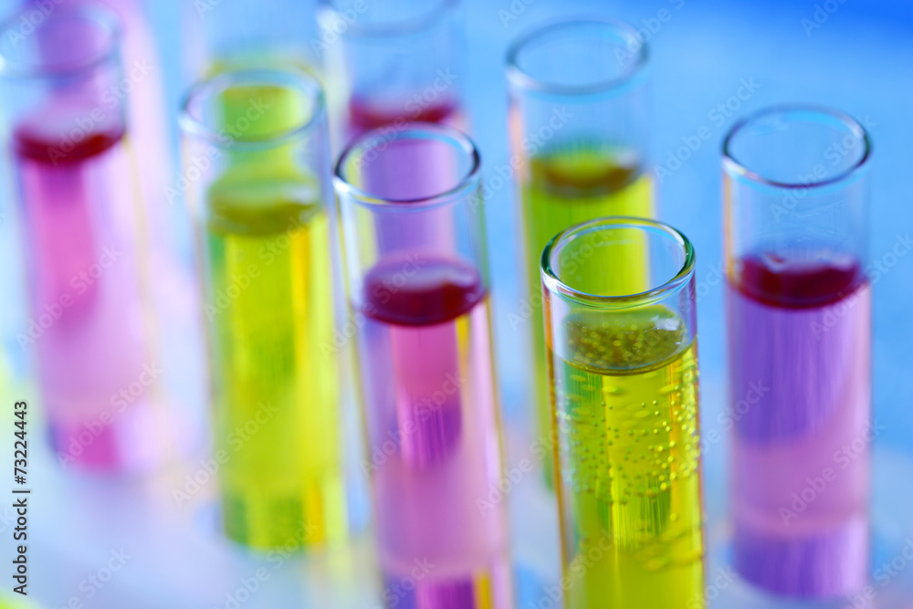 Test-tubes with liquid on color background Test-tubes with liquid on color background