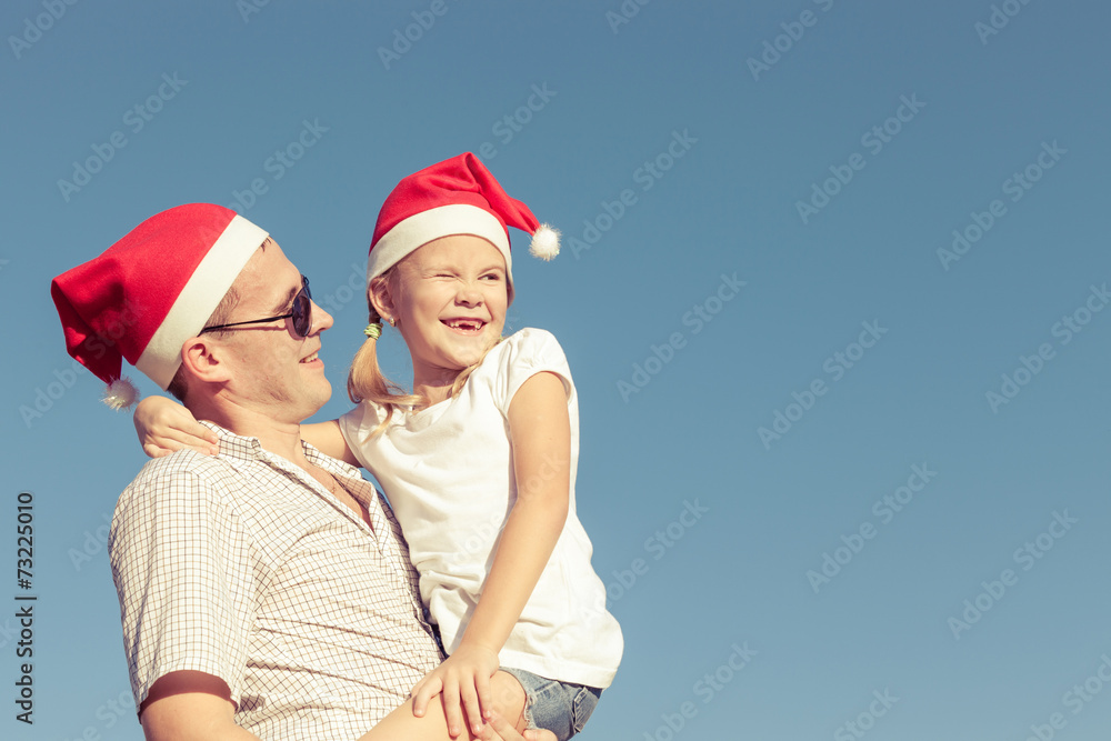 Obraz premium father and little daughter playing near a house
