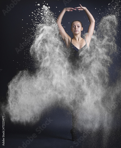 Fototapeta Naklejka Na Ścianę i Meble -  Dancing woman and flying dust.