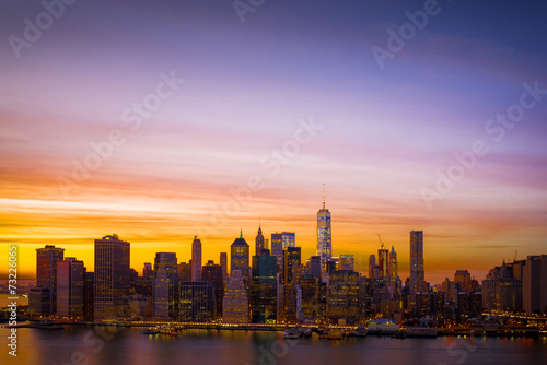 Downtown Manhattan skyline and the East River at sunset  includi