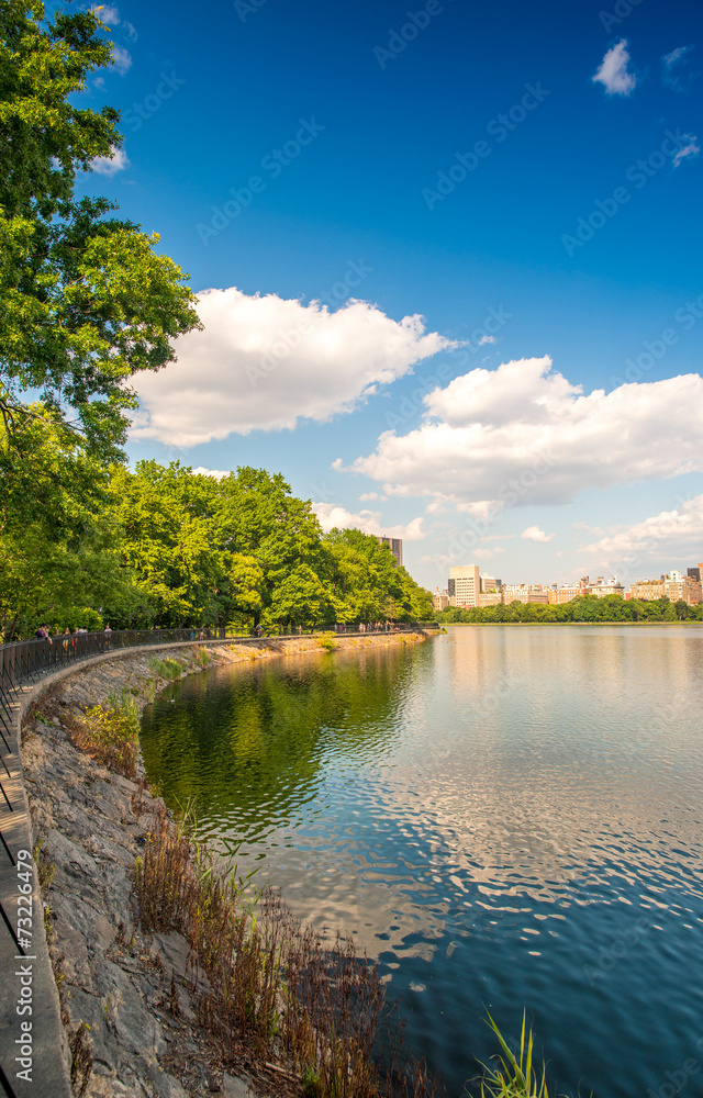 Beautiful colors of Central Park with lake reflections at dusk -