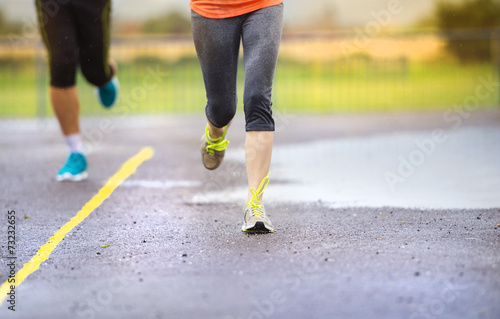 Couple running in rainy weather