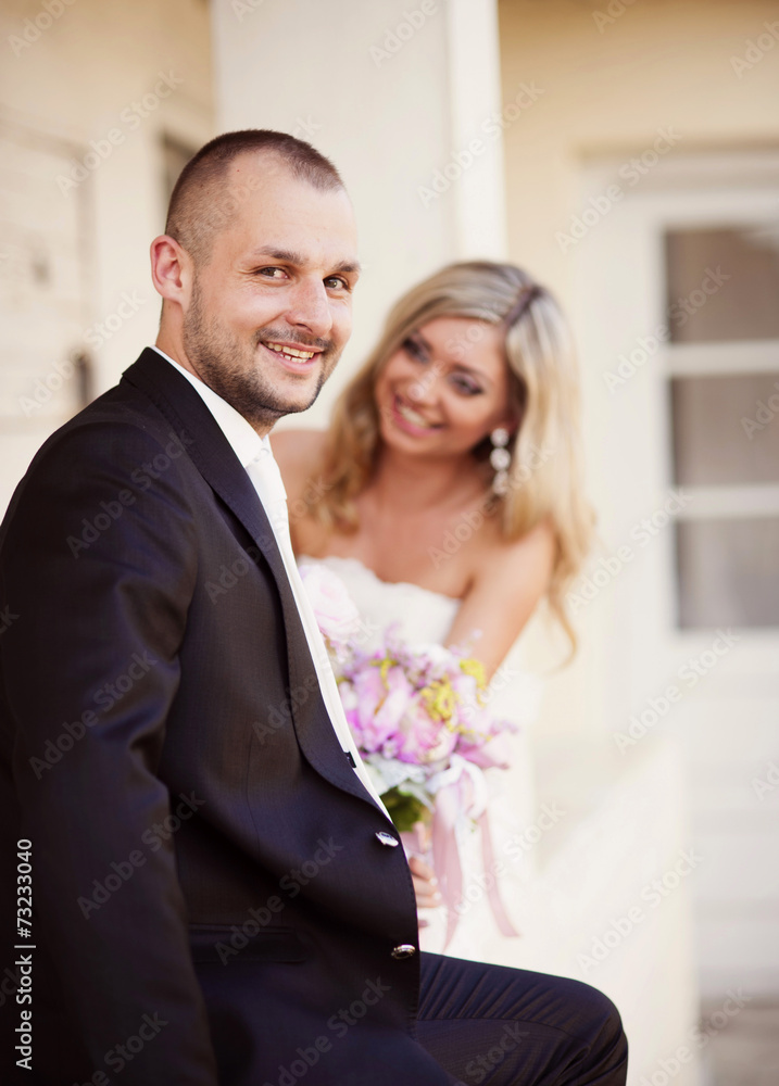 Bride and groom by the old house Bride and groom by the old house