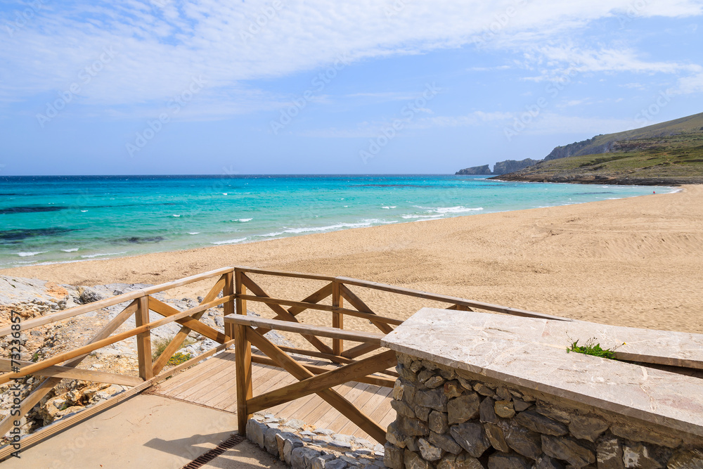 Walkway to sand beach in Cala Mesquida bay, Majorca island