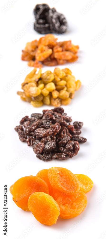 Obraz premium Mix dried fruit variety over white background