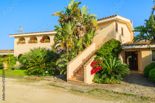 House in tropical gardens in Villasimius town, Sardinia © pkazmierczak
