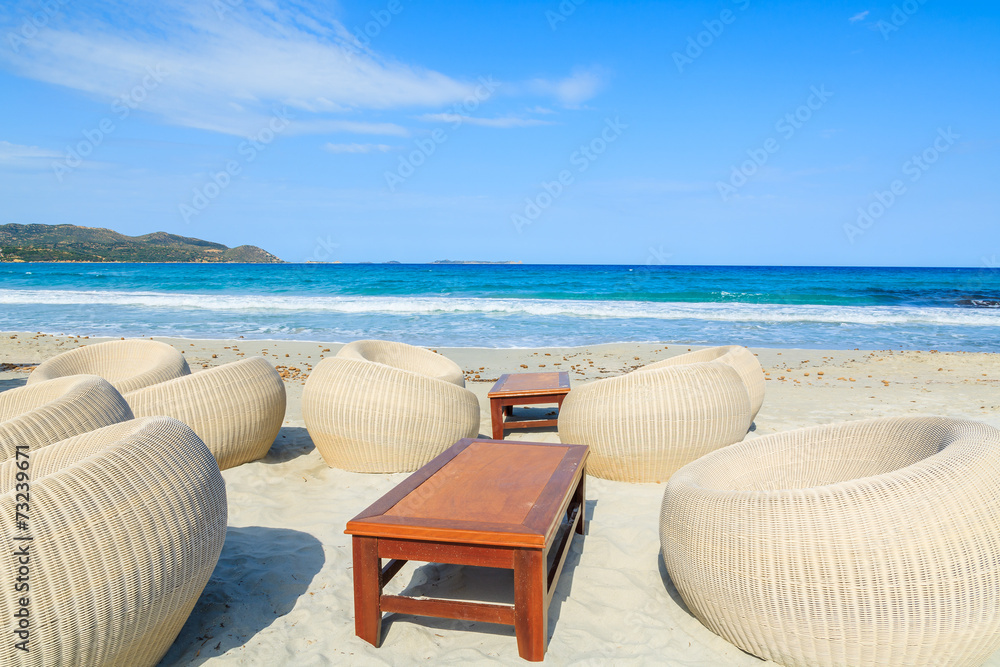 Beach bar chairs on sandy Porto Giunco beach, Sardinia island