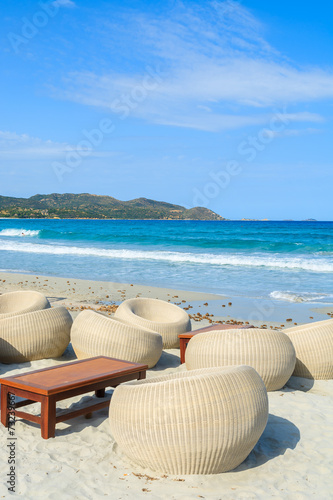 Beach bar chairs on sandy Porto Giunco beach, Sardinia island