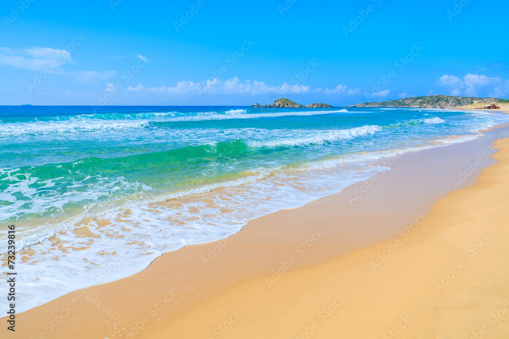 Sea waves on Chia beach and turquoise sea water, Sardinia island