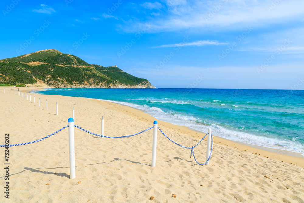 White poles and rope marking walkway to Capo Boi beach, Sardinia White poles and rope marking walkway to Capo Boi beach, Sardinia