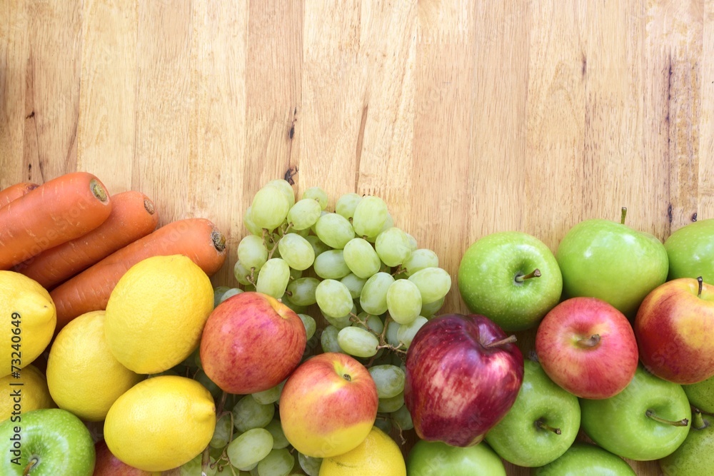 Organic fruits and vegetables mixed on the plank Organic fruits and vegetables mixed on the plank