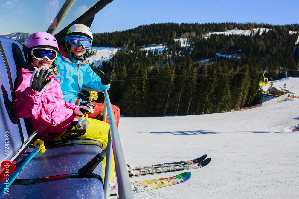 Skiing,  ski lif. Skiers enjoying winter vacation