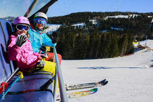 Skiing, ski lif. Skiers enjoying winter vacation