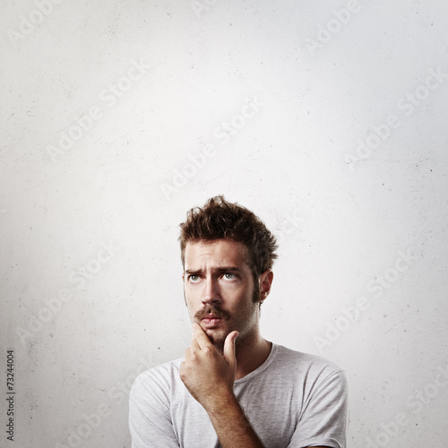 Portrait of a young man in doubt
