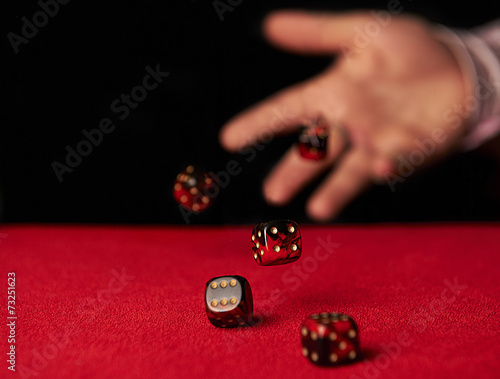 Male hand rolling dice