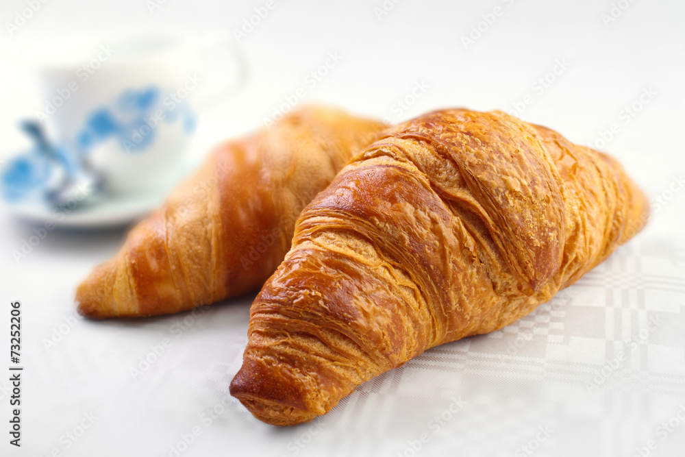 Baked croissant breakfast with coffee cup