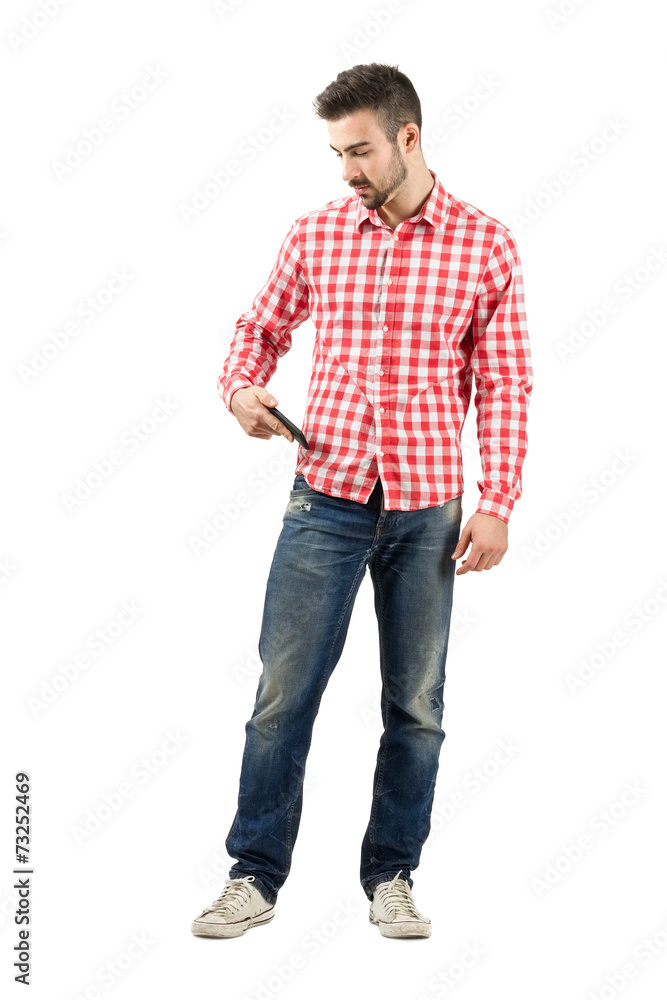 Man checking mobile phone from pocket Man checking mobile phone from pocket