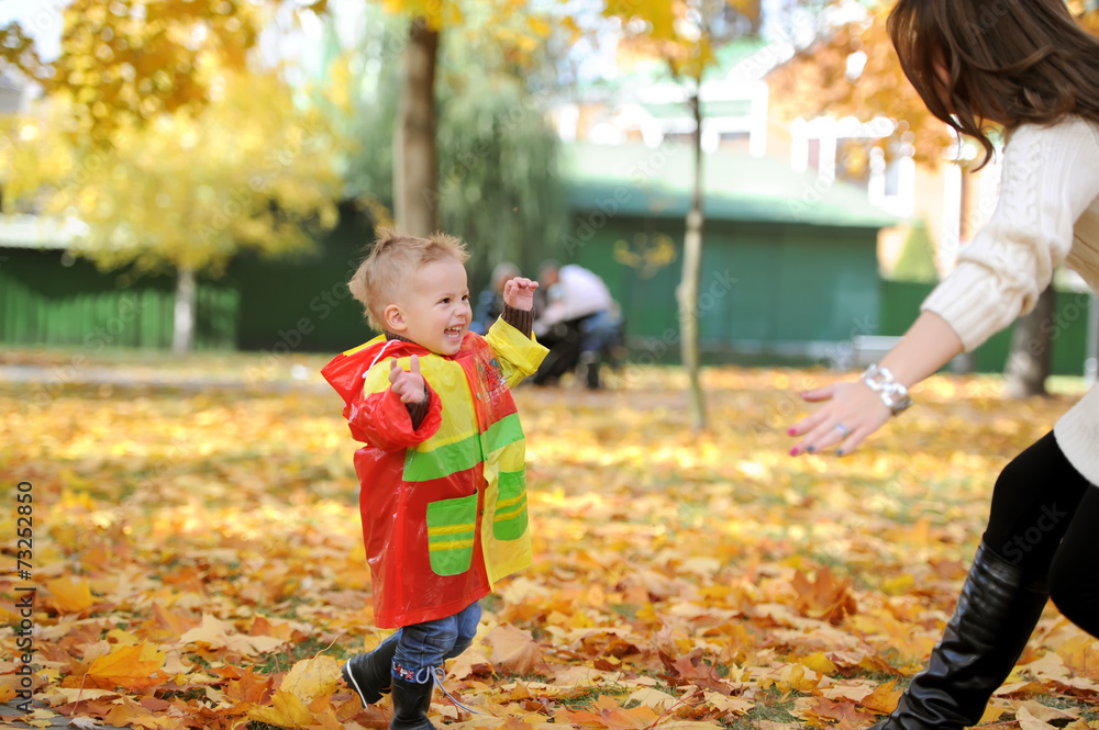 mother and the kid walk in autumn park mother and the kid walk in autumn park