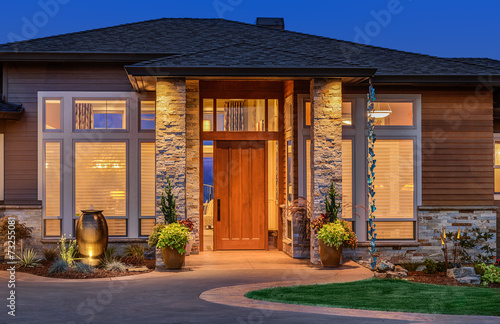 Elegant front door of home with welcome mat
