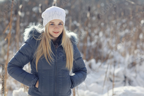 winter portrait of a cute blonde teen