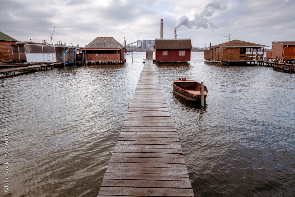 Bokod lake with pier, boat and fishing huts