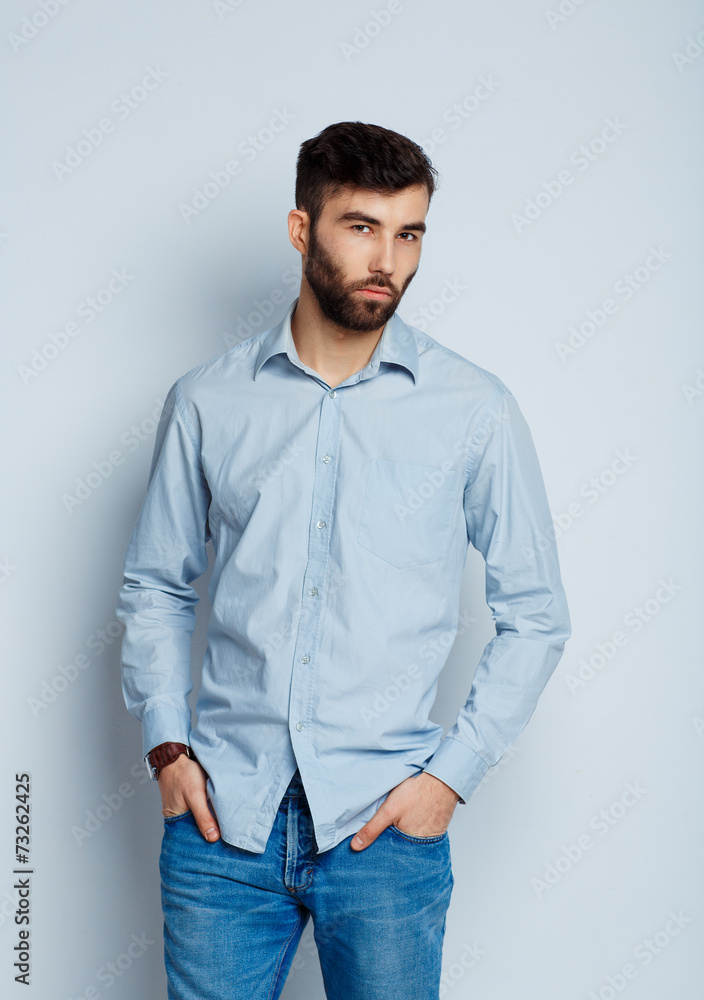A young bearded man smiling A young bearded man smiling