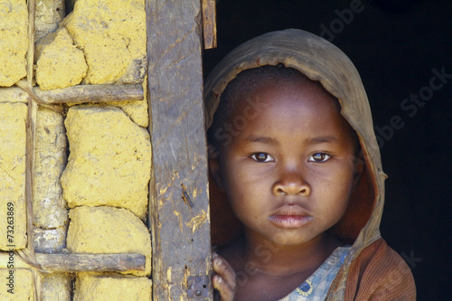 Madagascar-shy and poor african girl with headkerchief photo