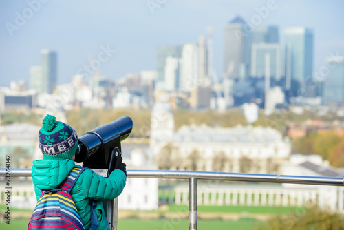 A boy looking into tower viewer