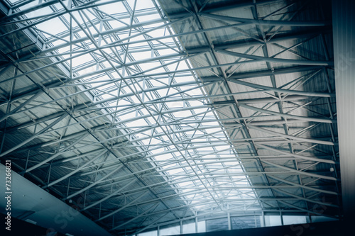 Big metal roof with panoramic windows at airport terminal