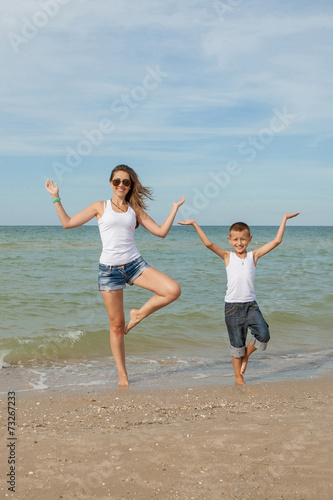 Mother and her son doing yoga