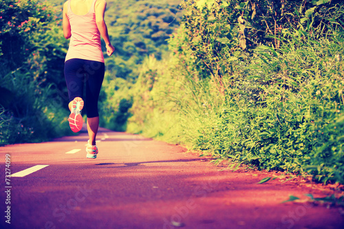 fitness woman runner running on trail