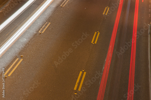 Road at night with light trails