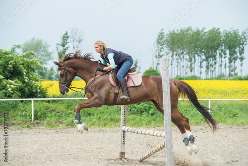 Jumping with horse © Dusan Kostic