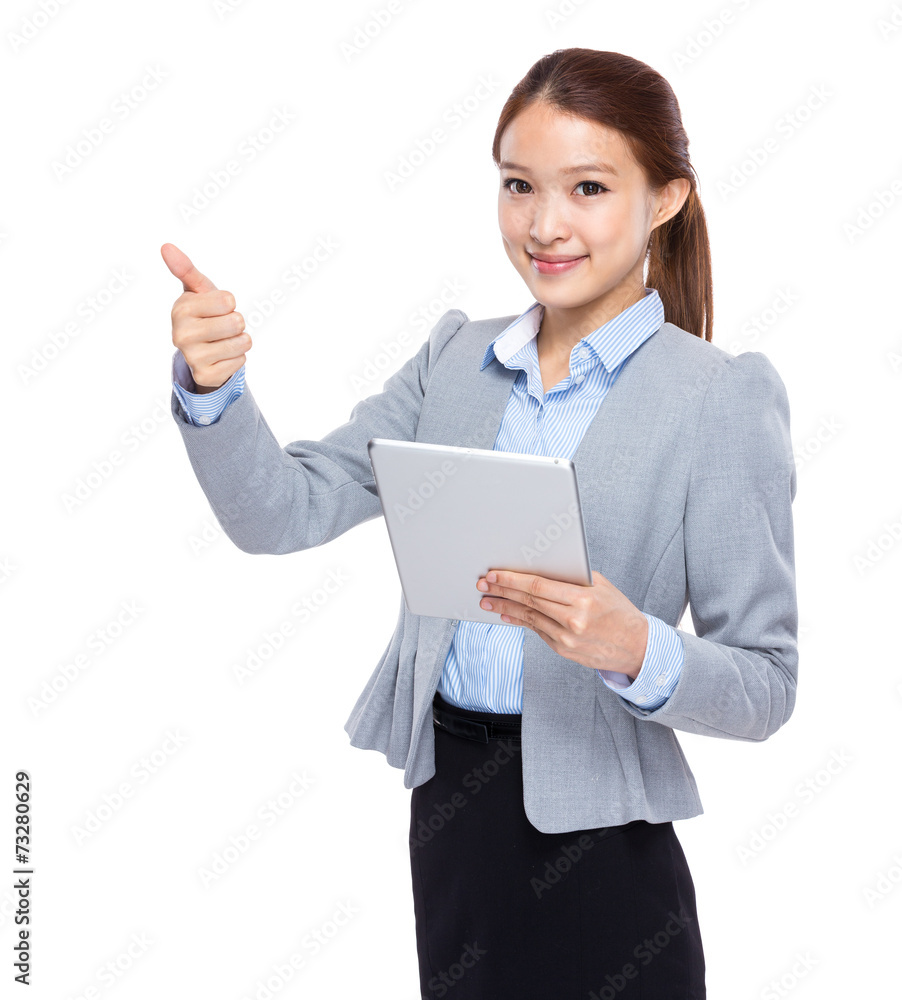 Asian Businesswoman use of tablet and thumb up Asian Businesswoman use of tablet and thumb up