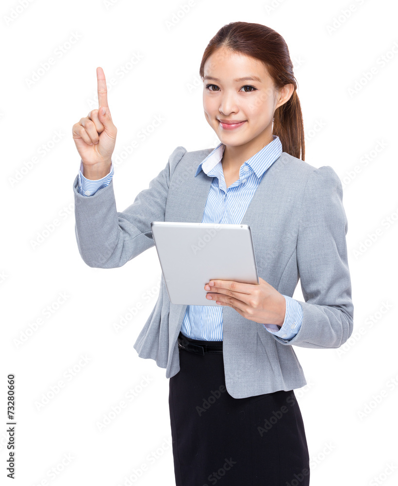 Businesswoman use of tableta and finger point up Businesswoman use of tableta and finger point up