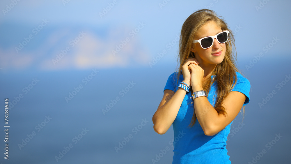 beautiful girl posing on the coast