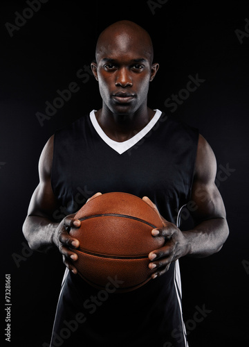 Portrait of male basketball player with a ball © Jacob Lund