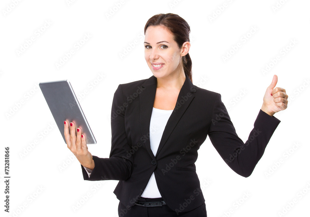 Businesswoman use of tablet and thumb up Businesswoman use of tablet and thumb up