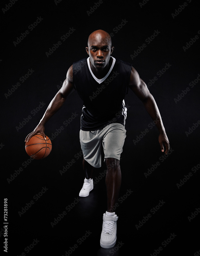 Young basketball player posing at camera Young basketball player posing at camera