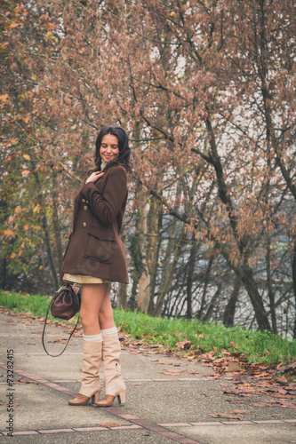 Photography Beautiful young woman posing in a city park