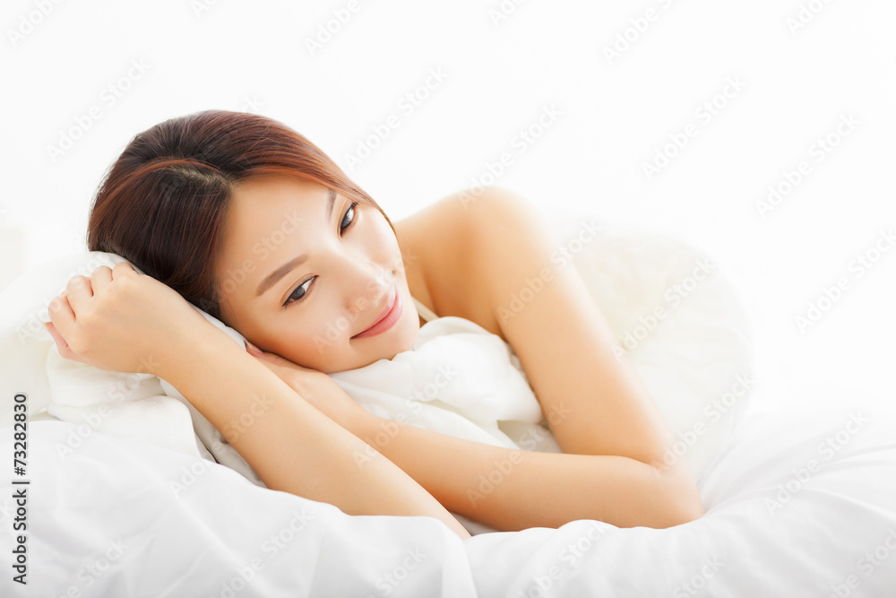 young Beautiful asian woman relaxing on the bed young Beautiful asian woman relaxing on the bed