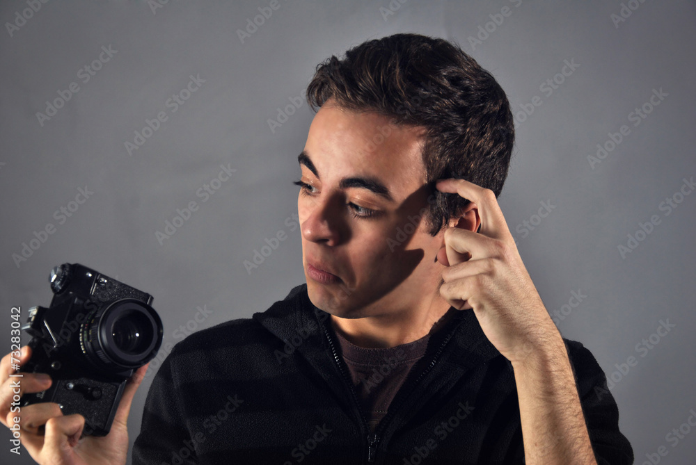 young photographer with analog camera young photographer with analog camera