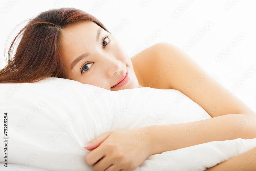 young Beautiful asian woman relaxing on the bed young Beautiful asian woman relaxing on the bed