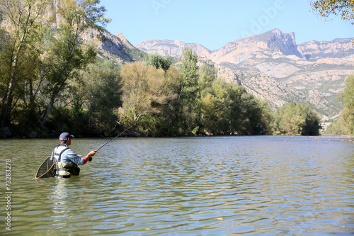 Fly fisherman fishing in spanish river