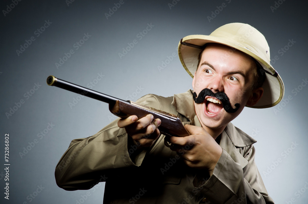 Man in safari hat in hunting concept Man in safari hat in hunting concept