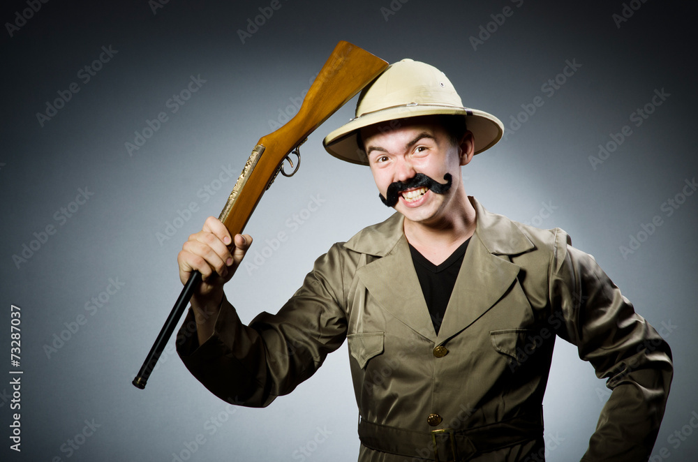 Man in safari hat in hunting concept Man in safari hat in hunting concept