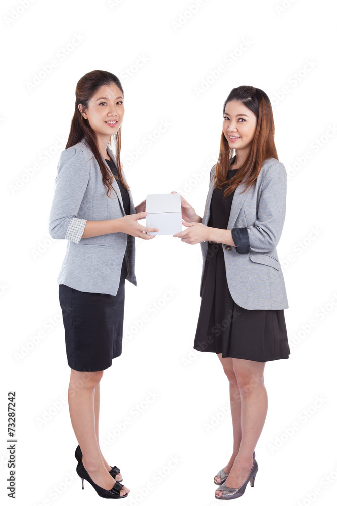 businesswomen giving a box to her businesswomen giving a box to her