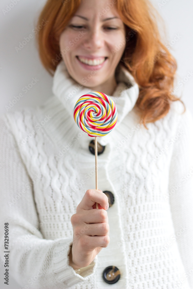 Cute hipster girl holding a lollipop Cute hipster girl holding a lollipop