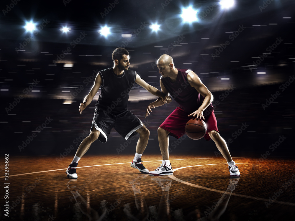 Two basketball players in action